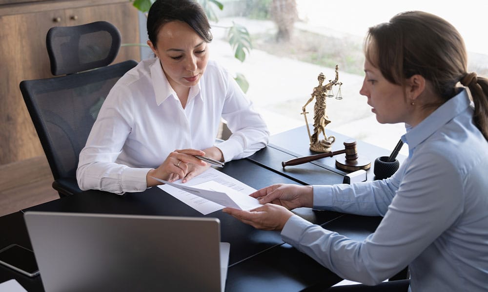 business owner receiving guidance from her commercial litigation lawyer in Houston, TX