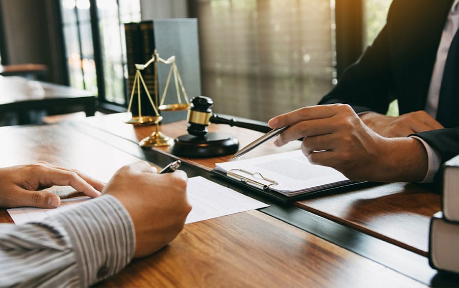 a commercial litigation lawyer giving advice to a client in Houston, TX