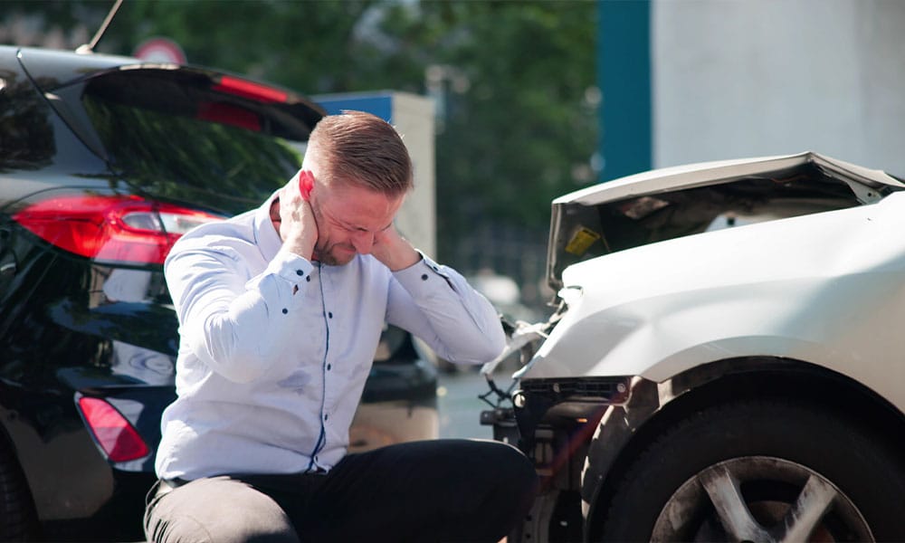 man stressed after a motor vehicle accident in Houston, TX