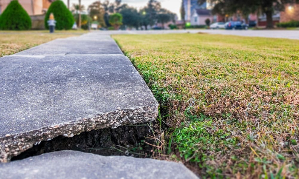 crack on a sidewalk that can cause a premises liability injury in Houston, TX