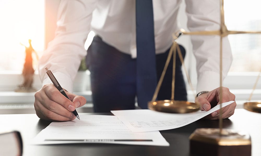 attorney reviewing a bread of contract case in Houston, TX